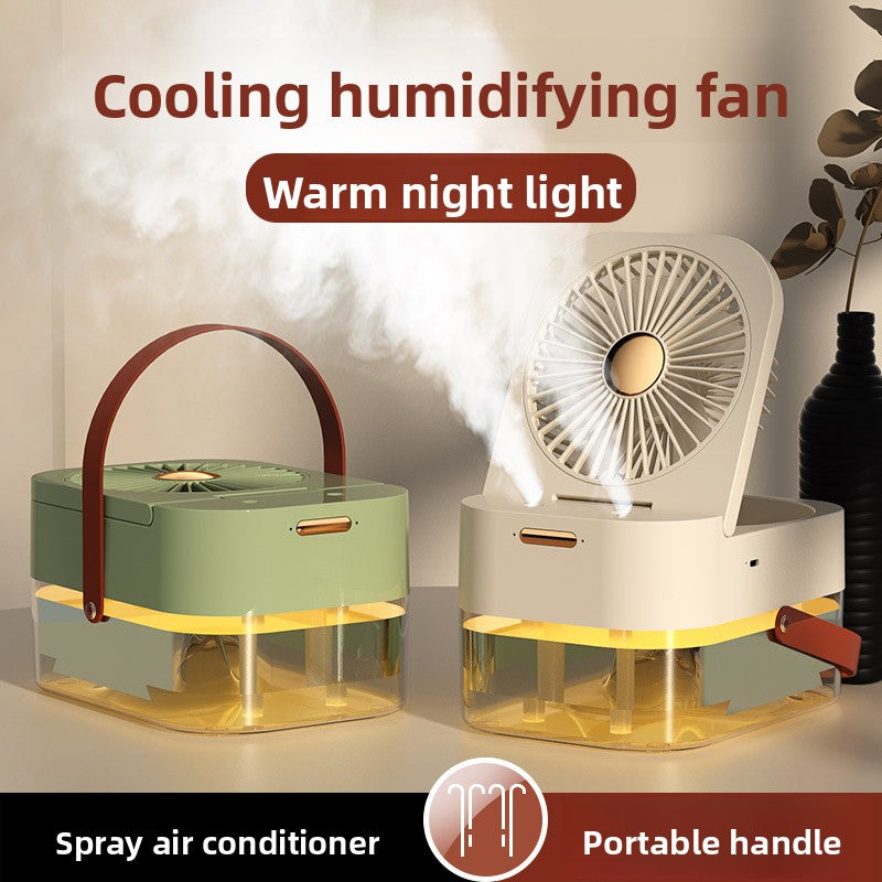 Two portable cooling humidifying fans shown side by side in a styled indoor setting. The left fan is sage green with a dark brown handle and clear water reservoir; the right fan is off-white with a warm light and a white mist plume rising from the water tray.