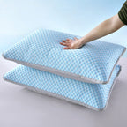 Two blue pillows with a hand touching one of them on a light gray background