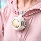 Person wearing a pink jacket with a white and yellow device attached to it.