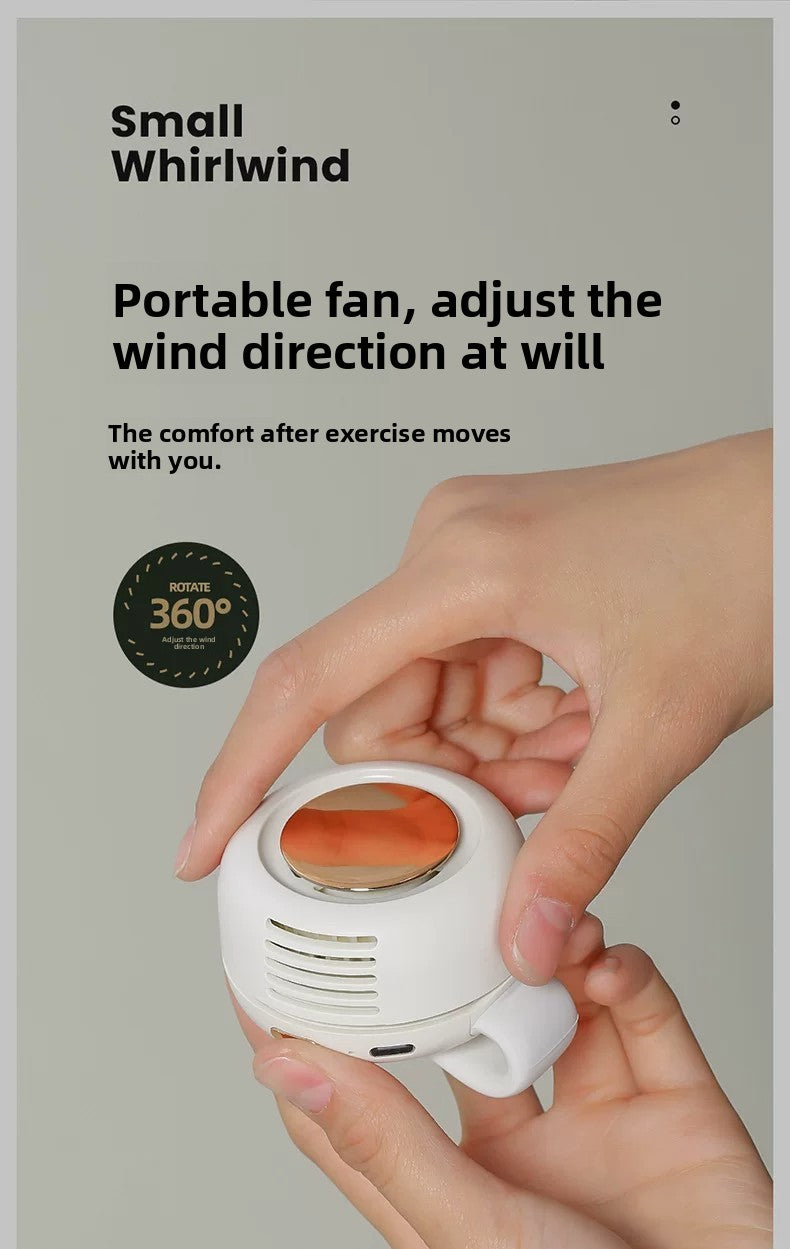 A person's hands holding a small white portable fan with a circular orange heating element, shown against a light gray background with promotional text.