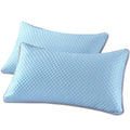 Two blue pillows with a textured pattern on a white background