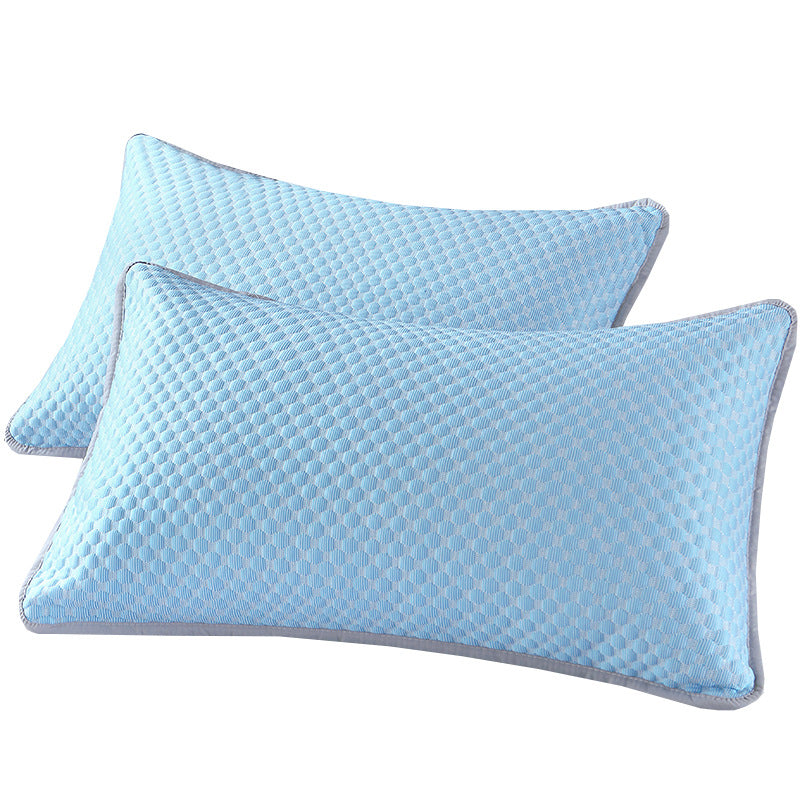 Two blue pillows with a textured pattern on a white background