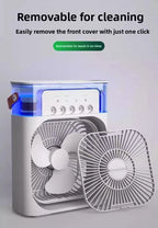 A compact white portable fan with a transparent top and blue light glow, shown with a removable front cover beside it. Text at the top says it is removable for cleaning and easy to open, with a small green reminder badge.